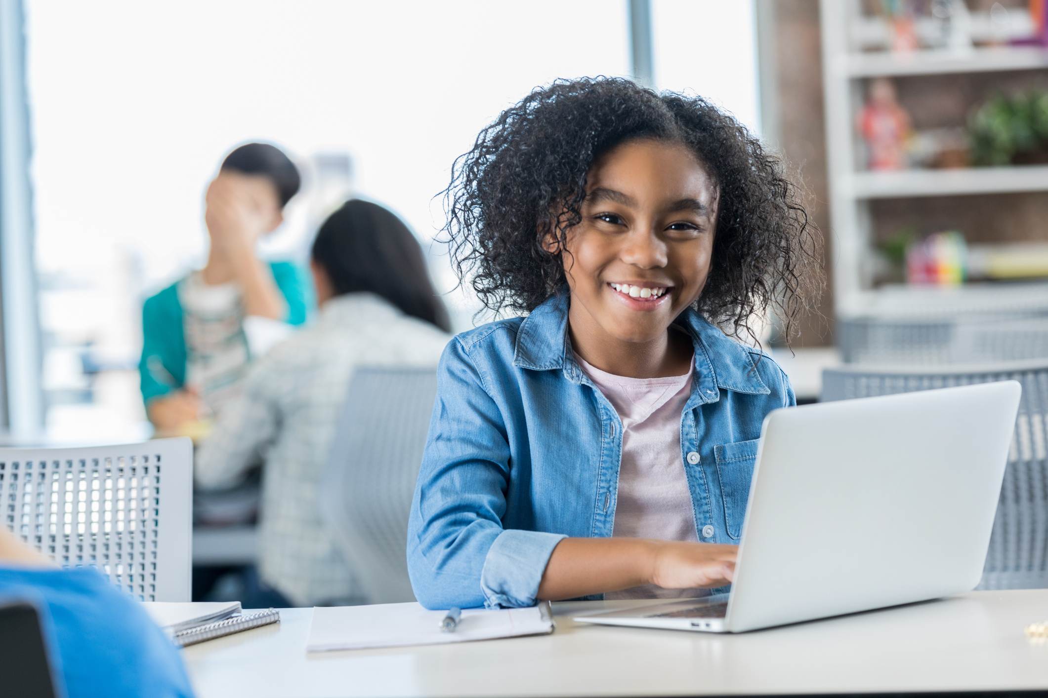 Independent schoolgirl uses laptop